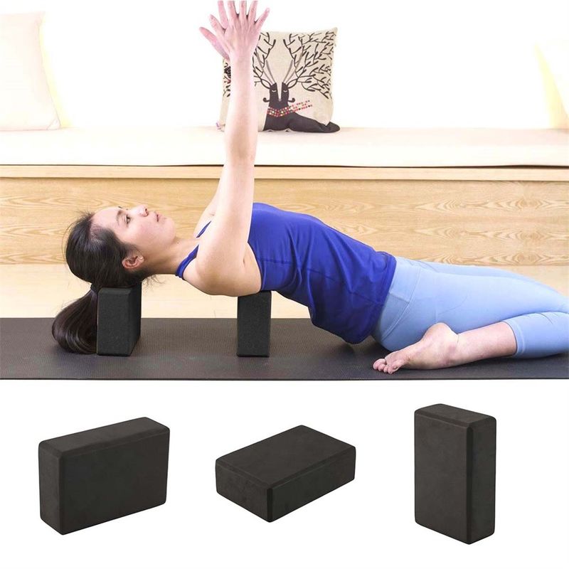 L'esercizio nero di yoga blocca il mattone dell'interno di yoga della schiuma che allunga la palestra Pilates dell'aiuto fornitore